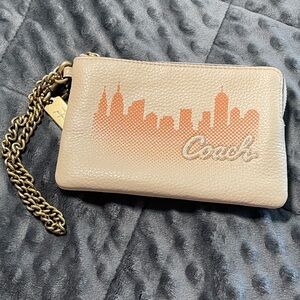 Coach x Jennifer Lopez Cream Wristlet wallet with Gold Chain and sunset skyline